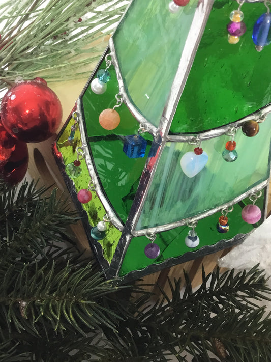 a 3D green stained glass christmas tree tea light holder