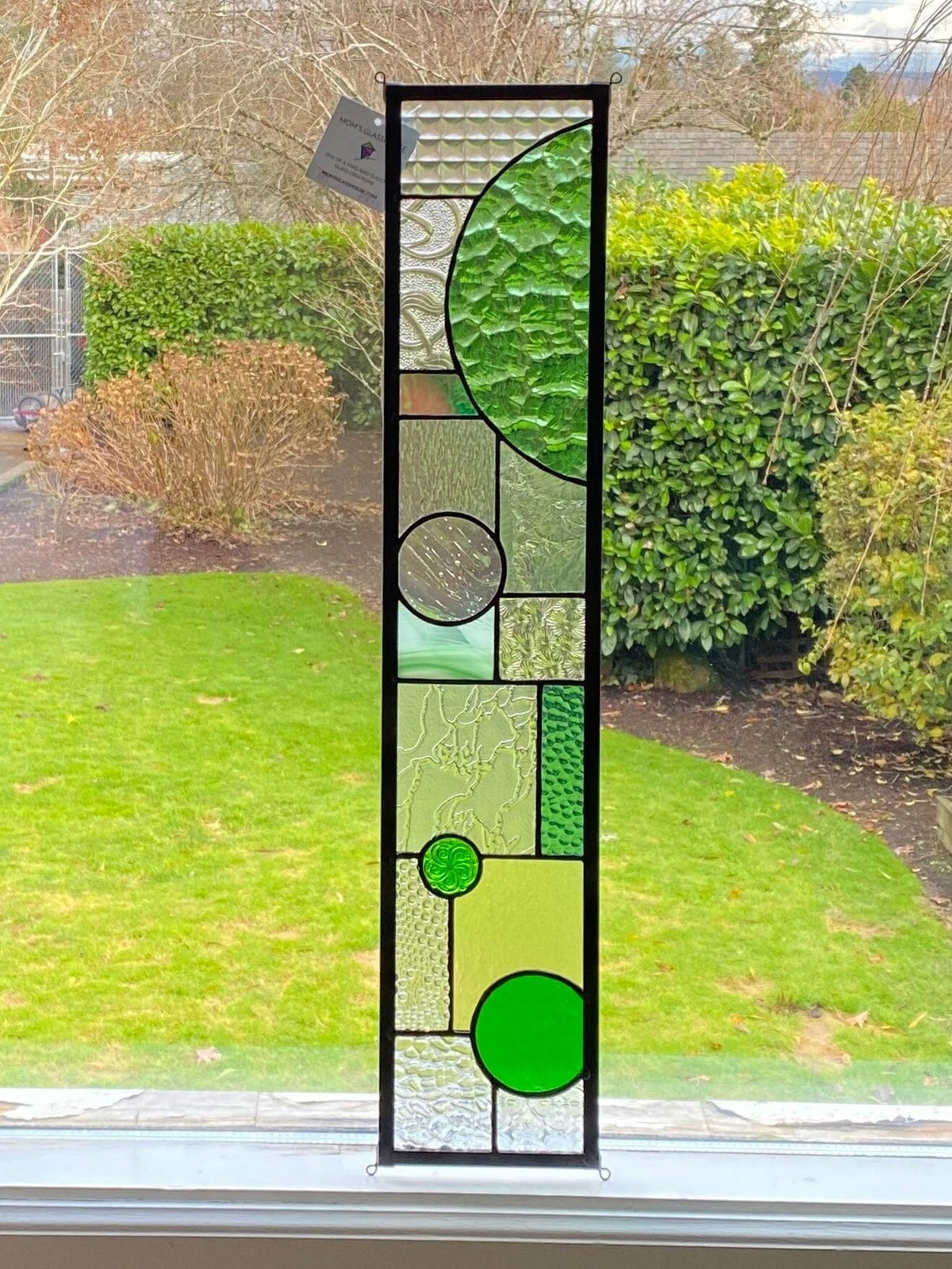 5" x 24" green half circle abstract stained glass panel