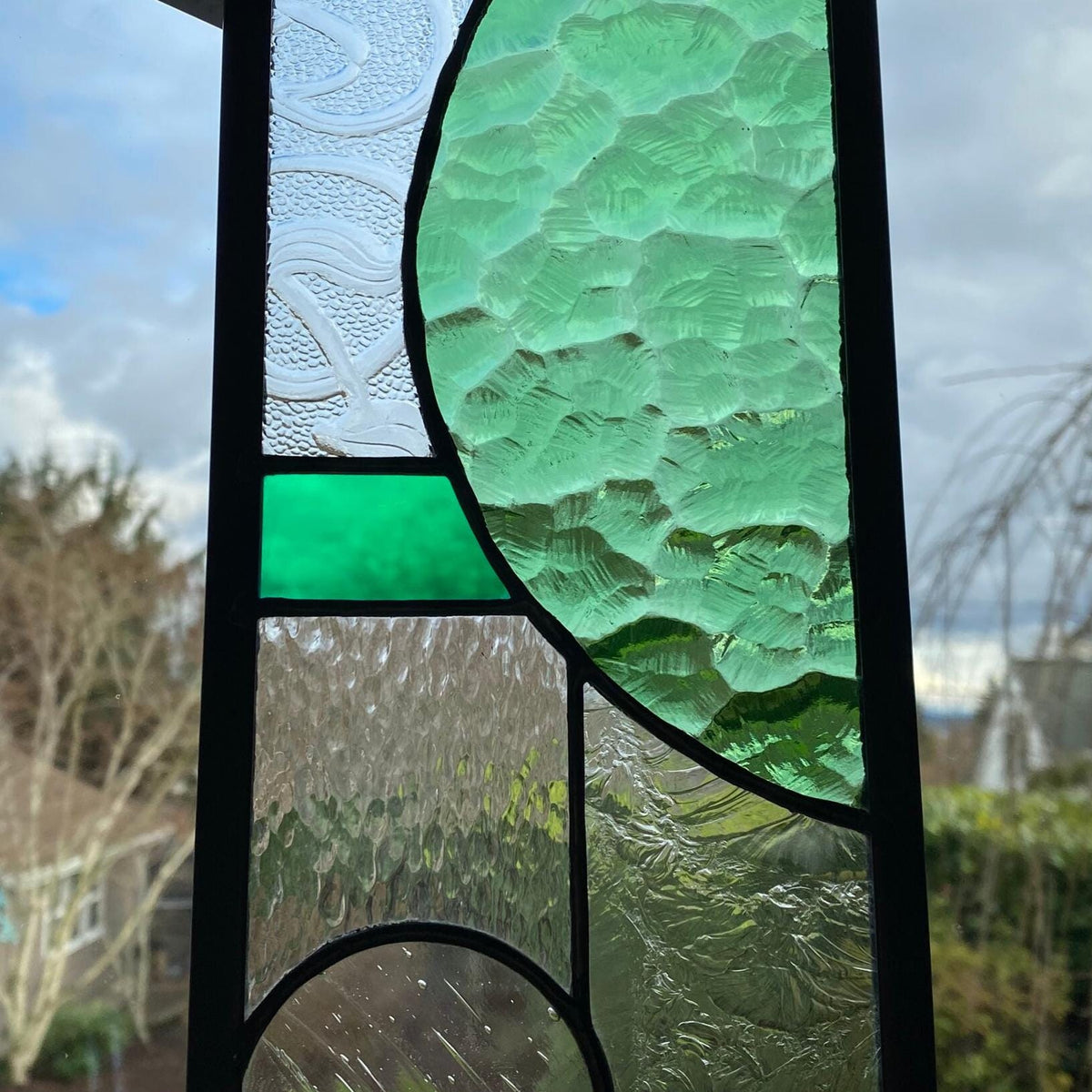 5" x 24" green half circle abstract stained glass panel