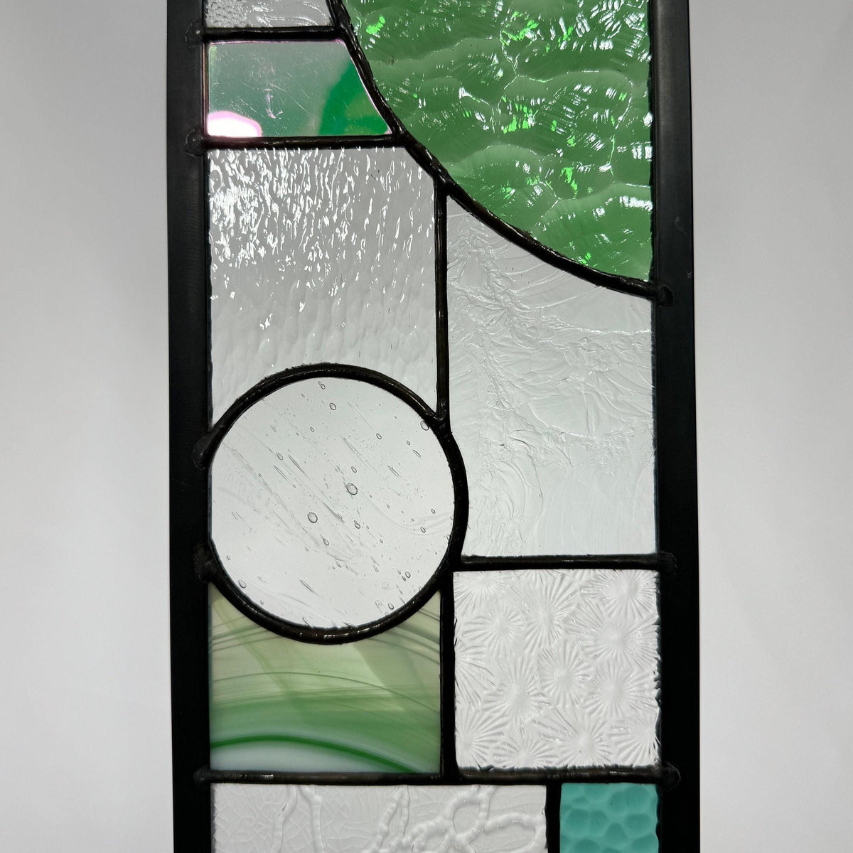 5" x 24" green half circle abstract stained glass panel